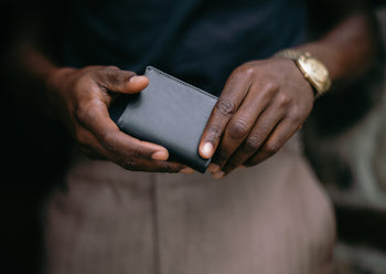 black card wallet in hands