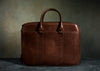 brown leather double zippered briefcase
