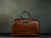 brown leather carry all with passport pocket
