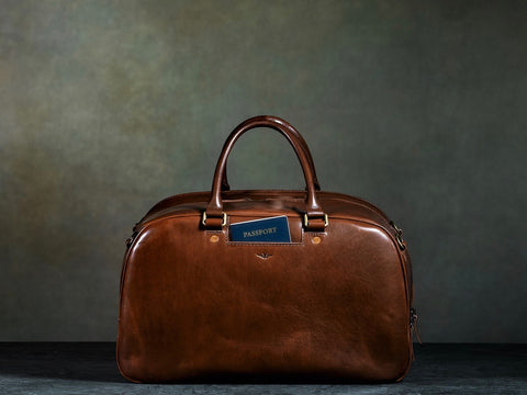 brown leather carry all with passport pocket