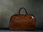 brown leather duffle bag