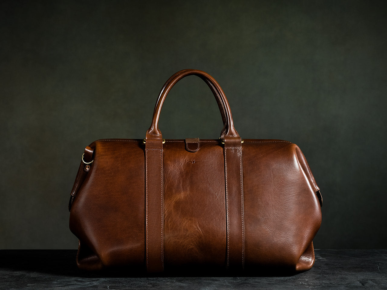 brown leather duffle bag