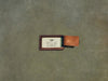 brown leather luggage tag with business card slot