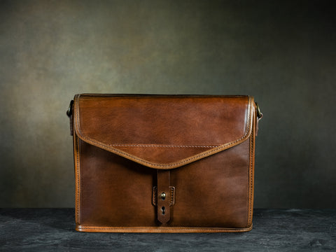 front of brown full grain leather camera bag
