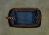 empty brown leather travel case